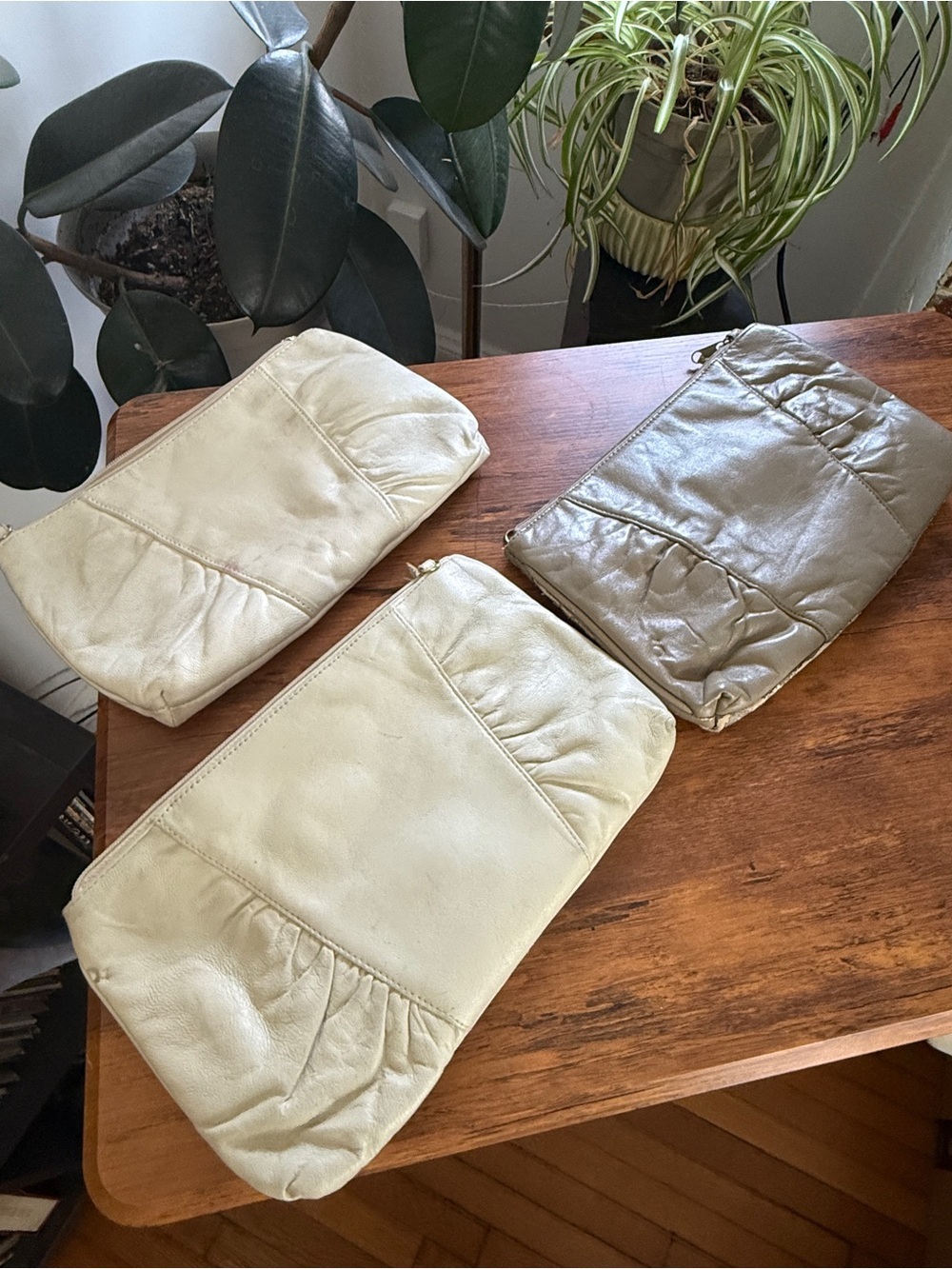 Three vintage women’s clutch bags neutral